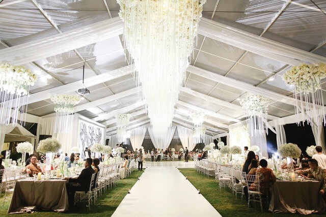 Large marquee with central walkway and dining either side